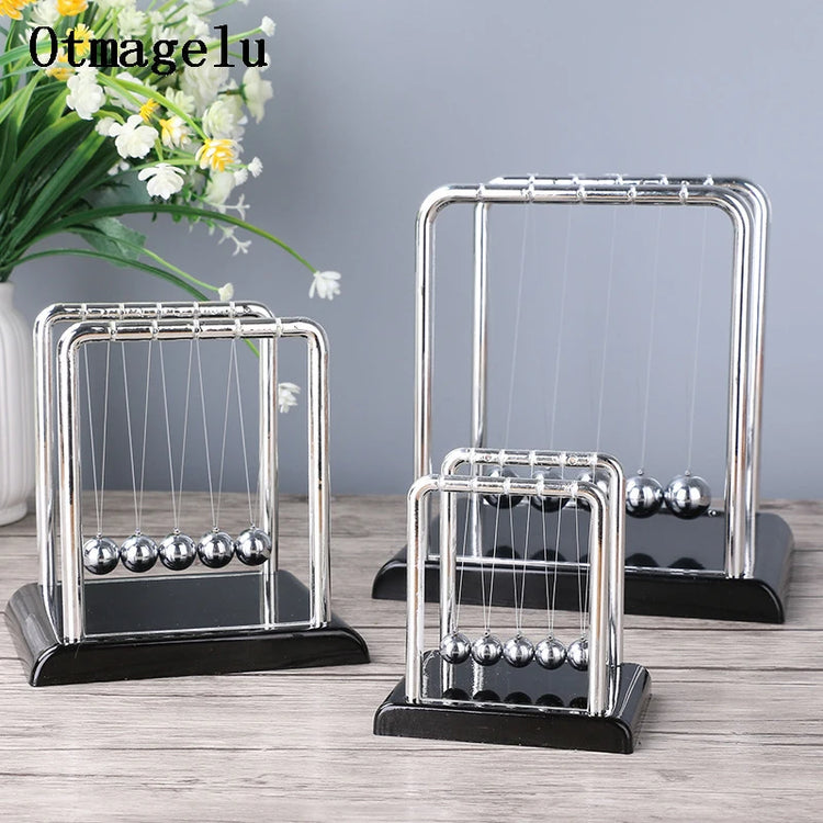 Science-themed home decor with mini Newton balance balls