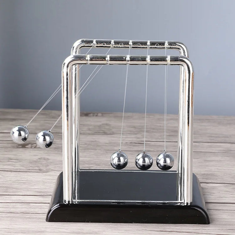 Science-themed home decor with mini Newton balance balls