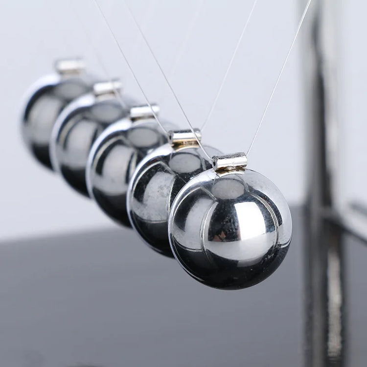 Science-themed home decor with mini Newton balance balls