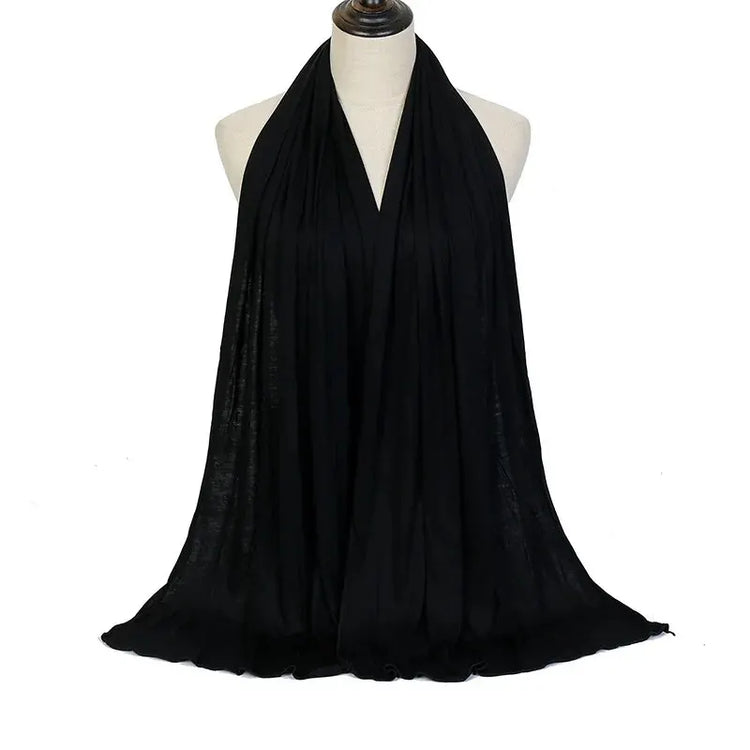 Soft plain cotton headscarf for women, used as a hijab or stylish headband wrap