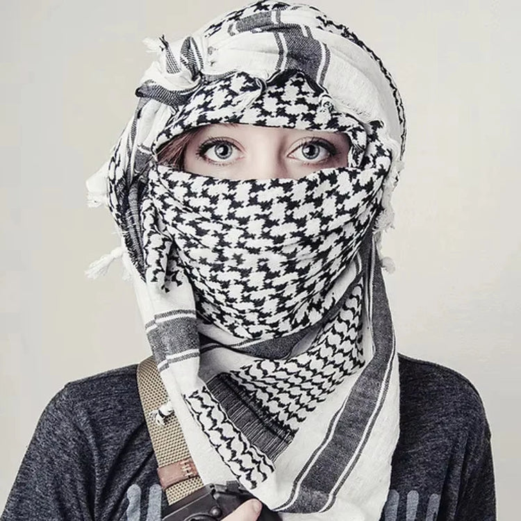 Arab shemagh scarf with traditional houndstooth pattern, styled as a face and neck wrap for sun protection