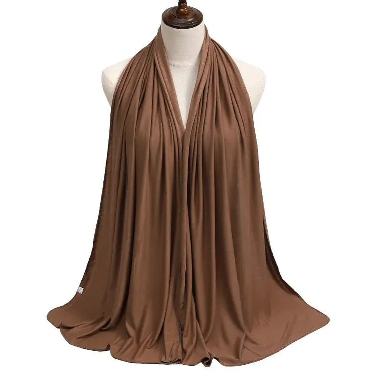 Soft plain cotton headscarf for women, used as a hijab or stylish headband wrap