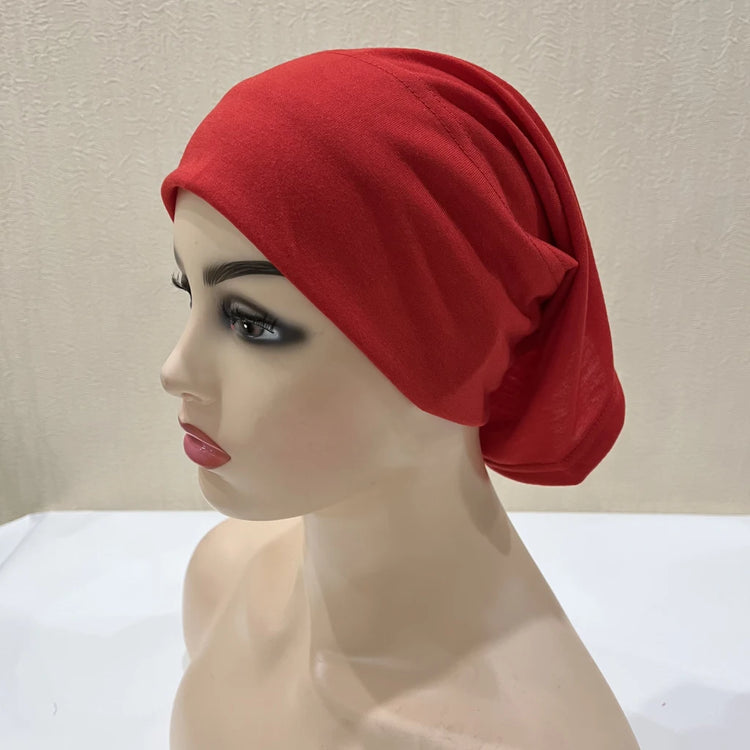 Lightweight spandex turban bonnet in beige, styled under a chiffon hijab