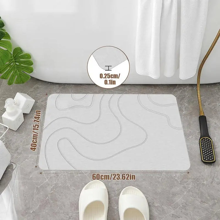 Absorbent stone bath mat with diatom mud material