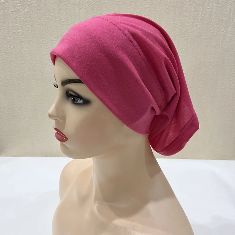 Lightweight spandex turban bonnet in beige, styled under a chiffon hijab