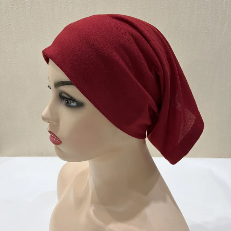 Lightweight spandex turban bonnet in beige, styled under a chiffon hijab