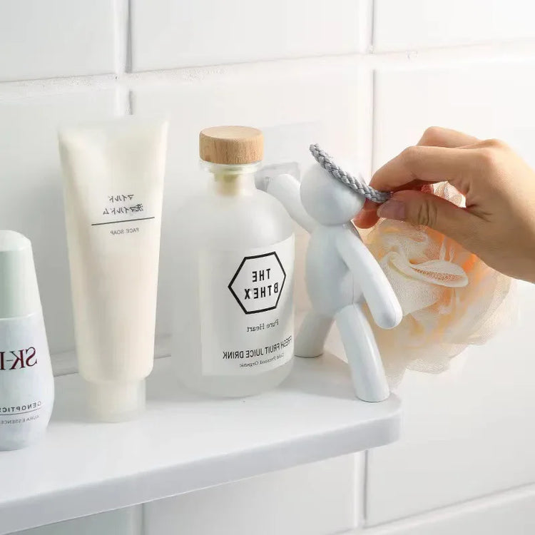 Self-adhesive plastic bathroom shelf for shampoo and towel storage