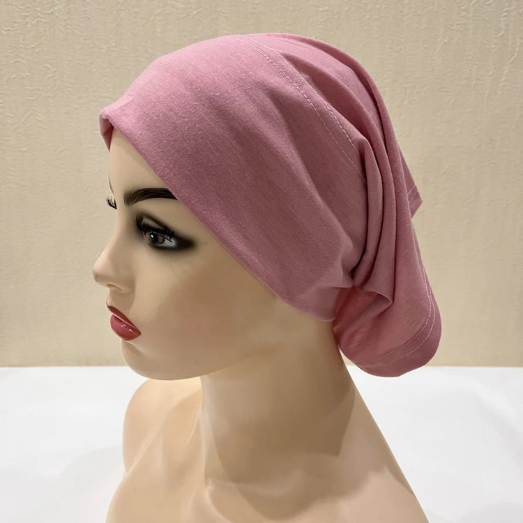 Lightweight spandex turban bonnet in beige, styled under a chiffon hijab