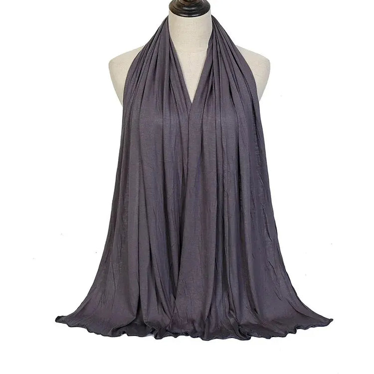 Soft plain cotton headscarf for women, used as a hijab or stylish headband wrap