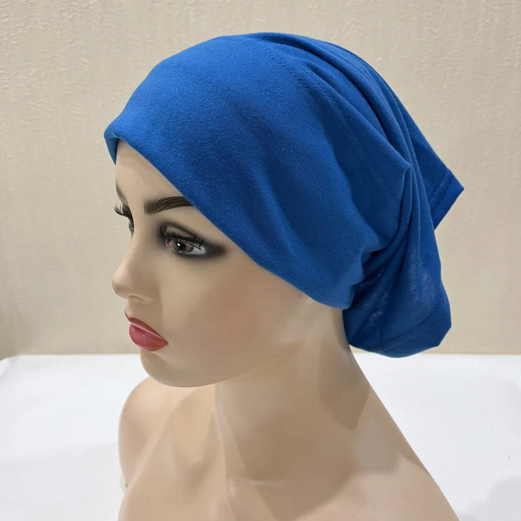 Lightweight spandex turban bonnet in beige, styled under a chiffon hijab