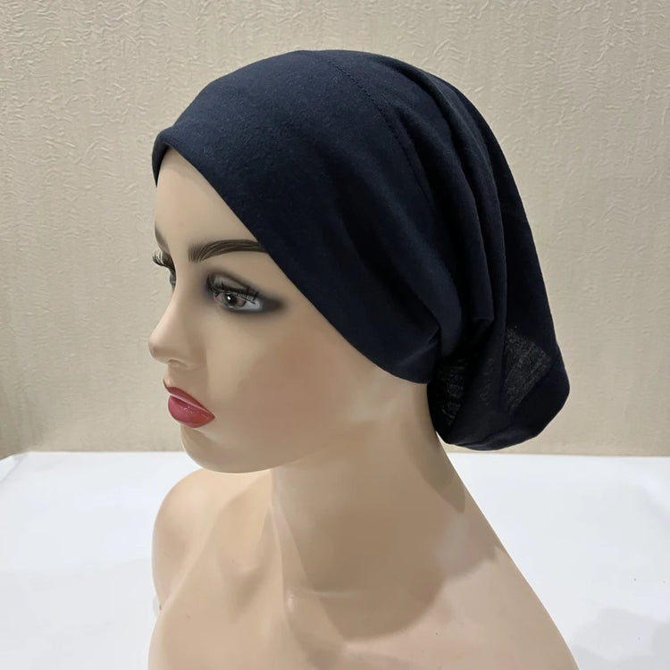 Lightweight spandex turban bonnet in beige, styled under a chiffon hijab