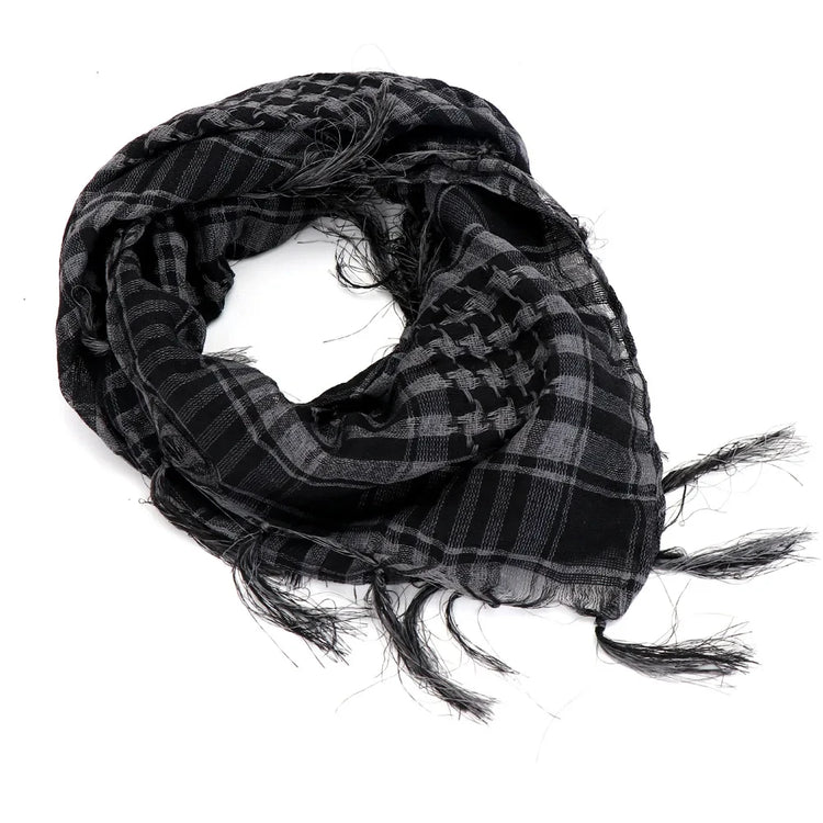 Arab shemagh scarf with traditional houndstooth pattern, styled as a face and neck wrap for sun protection