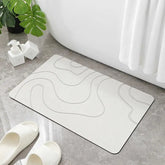 Absorbent stone bath mat with diatom mud material