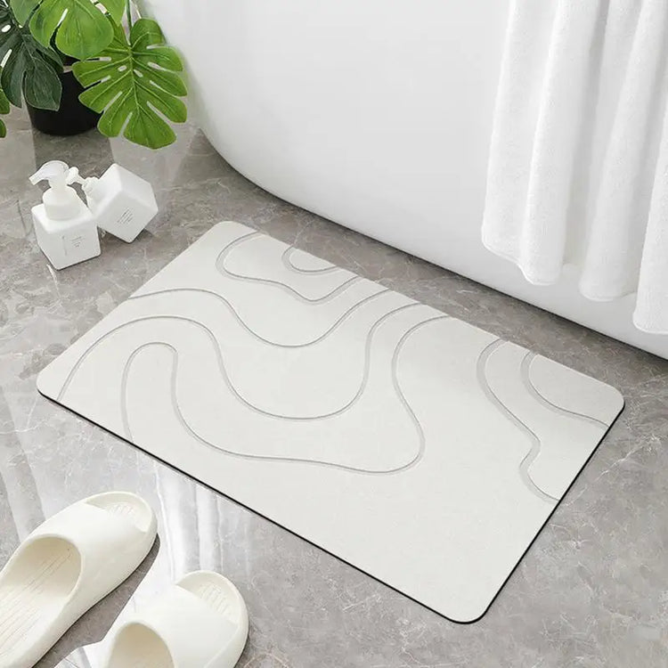 Absorbent stone bath mat with diatom mud material