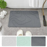 Absorbent stone bath mat with diatom mud material