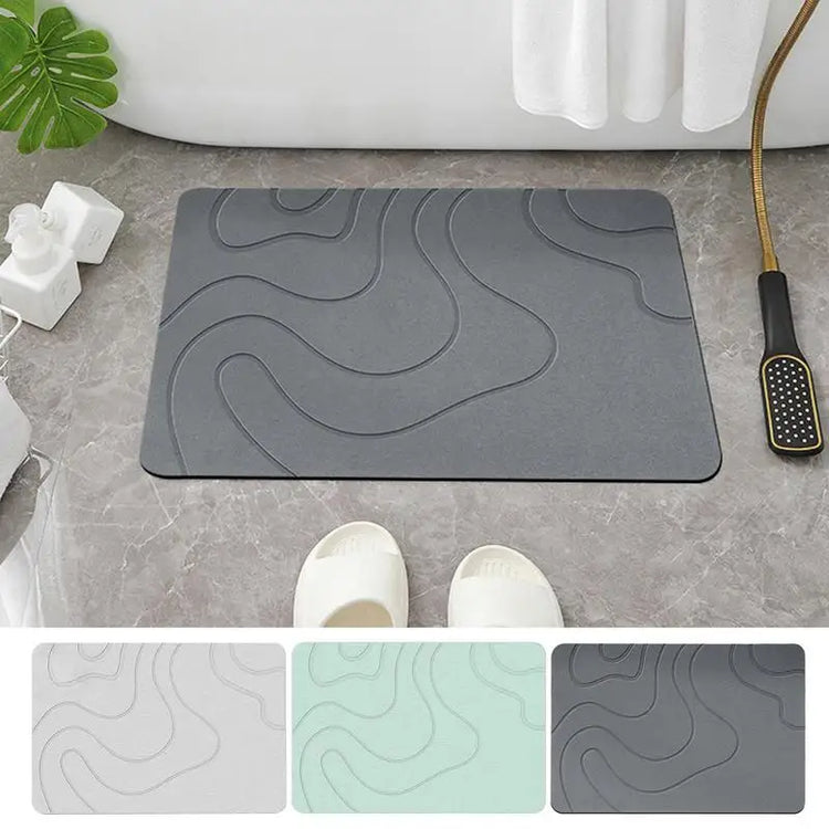 Absorbent stone bath mat with diatom mud material