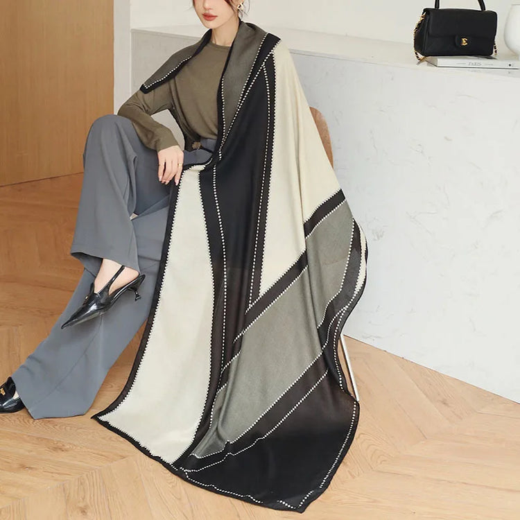 Elegant striped shawl wrap with tassel ends, suitable for casual and formal wear