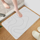 Absorbent stone bath mat with diatom mud material