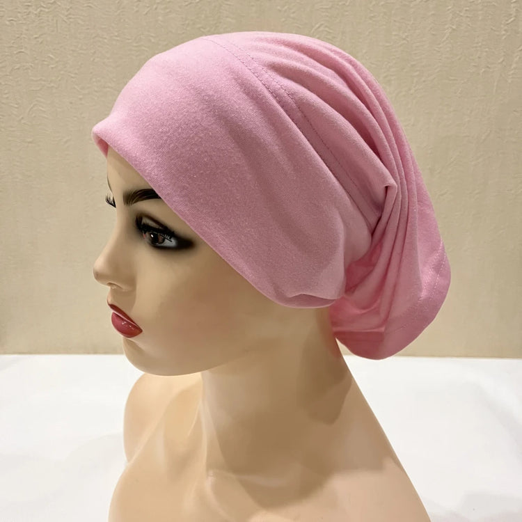 Lightweight spandex turban bonnet in beige, styled under a chiffon hijab