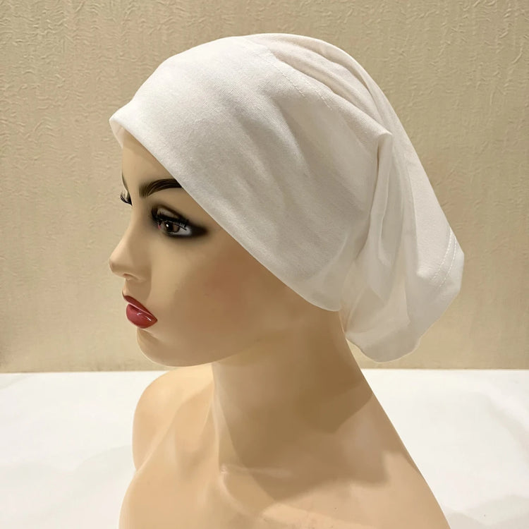 Lightweight spandex turban bonnet in beige, styled under a chiffon hijab