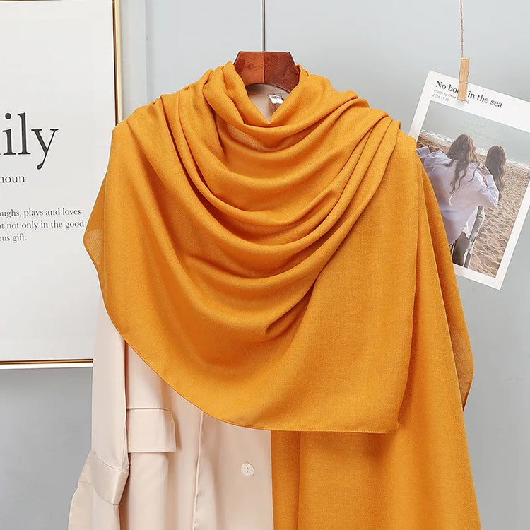 Elegant striped shawl wrap with tassel ends, suitable for casual and formal wear