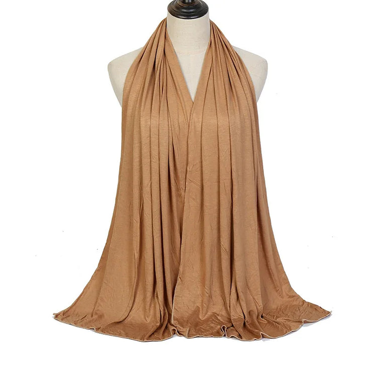 Soft plain cotton headscarf for women, used as a hijab or stylish headband wrap