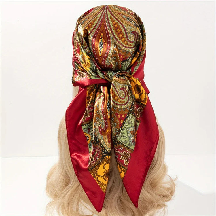 Elegant paisley print scarf styled as a fashionable necktie or handbag accessory