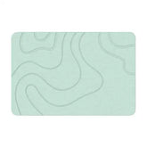 Absorbent stone bath mat with diatom mud material