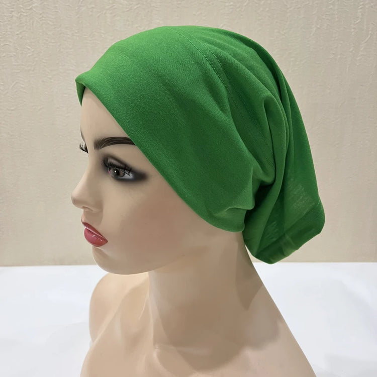 Lightweight spandex turban bonnet in beige, styled under a chiffon hijab