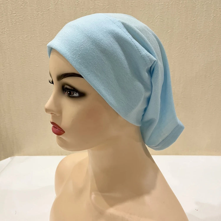 Lightweight spandex turban bonnet in beige, styled under a chiffon hijab