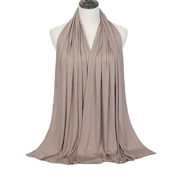 Soft plain cotton headscarf for women, used as a hijab or stylish headband wrap