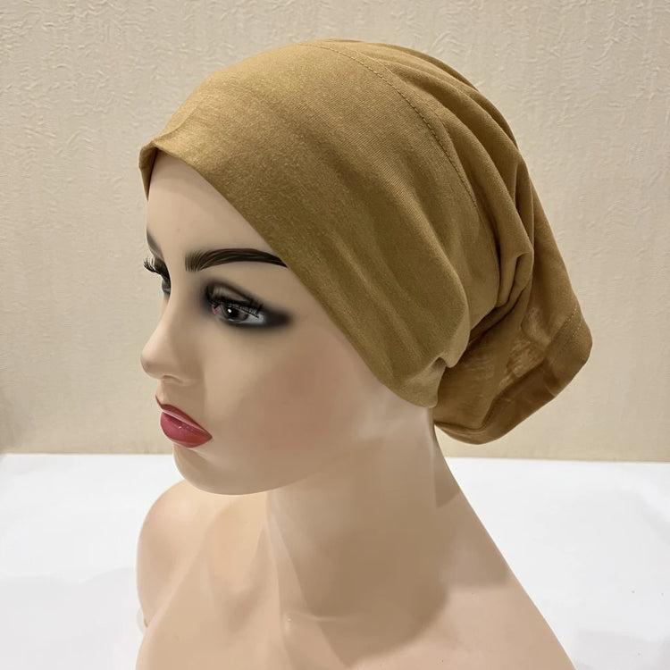 Lightweight spandex turban bonnet in beige, styled under a chiffon hijab