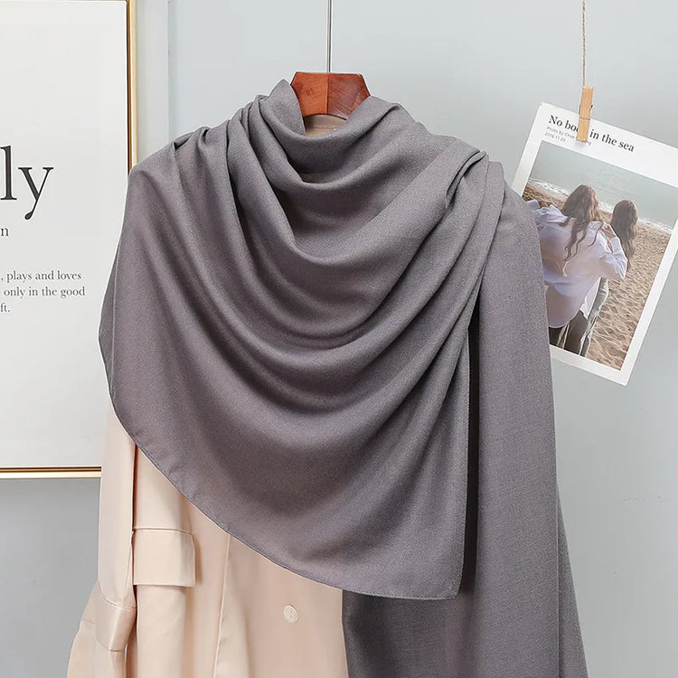 Elegant striped shawl wrap with tassel ends, suitable for casual and formal wear