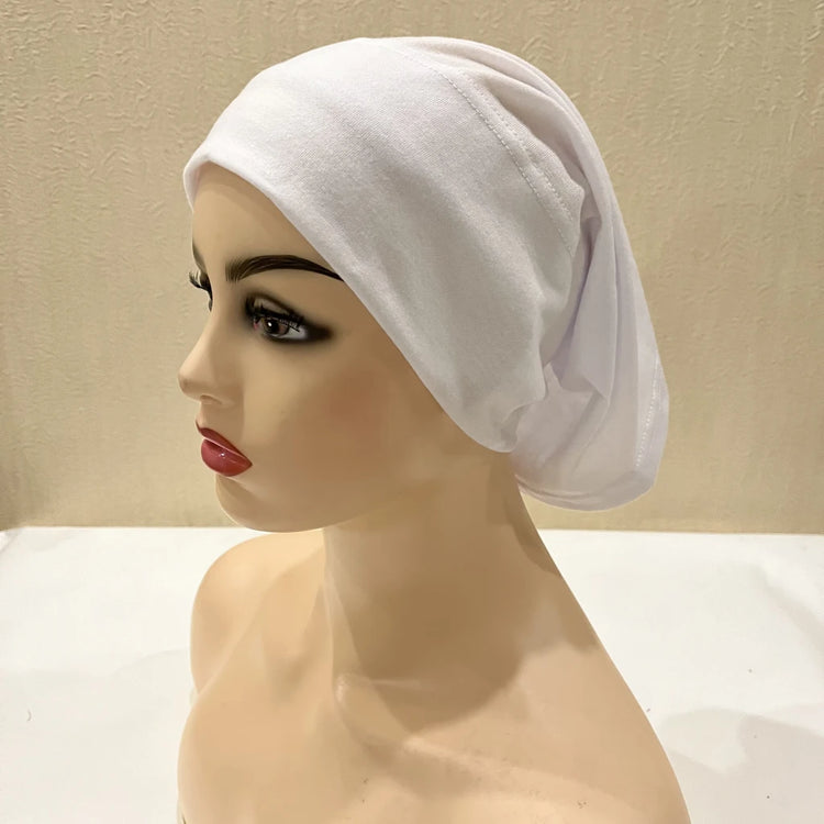 Lightweight spandex turban bonnet in beige, styled under a chiffon hijab