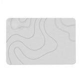 Absorbent stone bath mat with diatom mud material