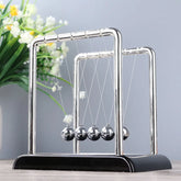 Science-themed home decor with mini Newton balance balls