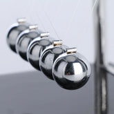 Science-themed home decor with mini Newton balance balls