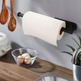 Space-saving kitchen organizer for paper towels and plastic wrap