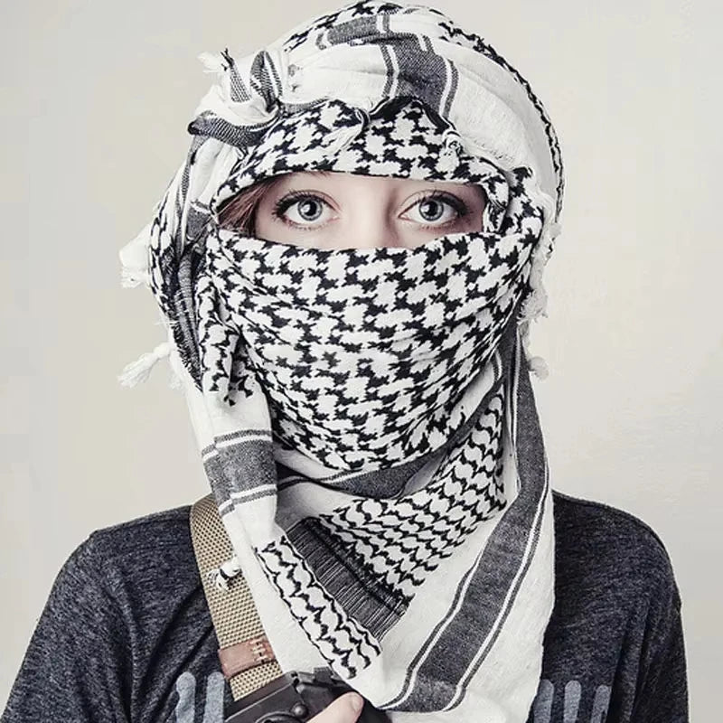 Arab shemagh scarf with traditional houndstooth pattern, styled as a face and neck wrap for sun protection