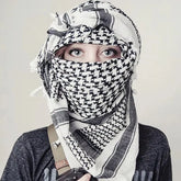 Arab shemagh scarf with traditional houndstooth pattern, styled as a face and neck wrap for sun protection