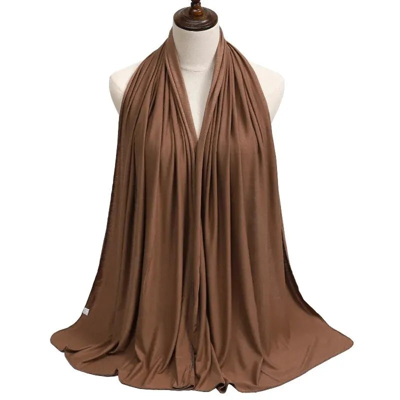 Soft plain cotton headscarf for women, used as a hijab or stylish headband wrap