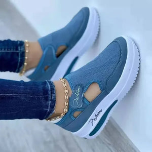 Women’s walking shoes with elevated platform sole and breathable mesh material