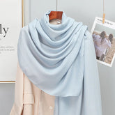Elegant striped shawl wrap with tassel ends, suitable for casual and formal wear