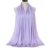 Long Muslim shawl made of modal cotton jersey fabric, wrapped elegantly around the head and ne
