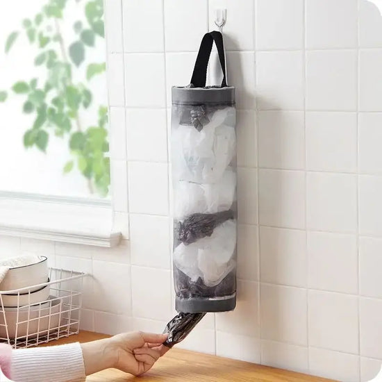 Hanging grey nylon bag holder for organizing plastic bags under cabinets or on walls