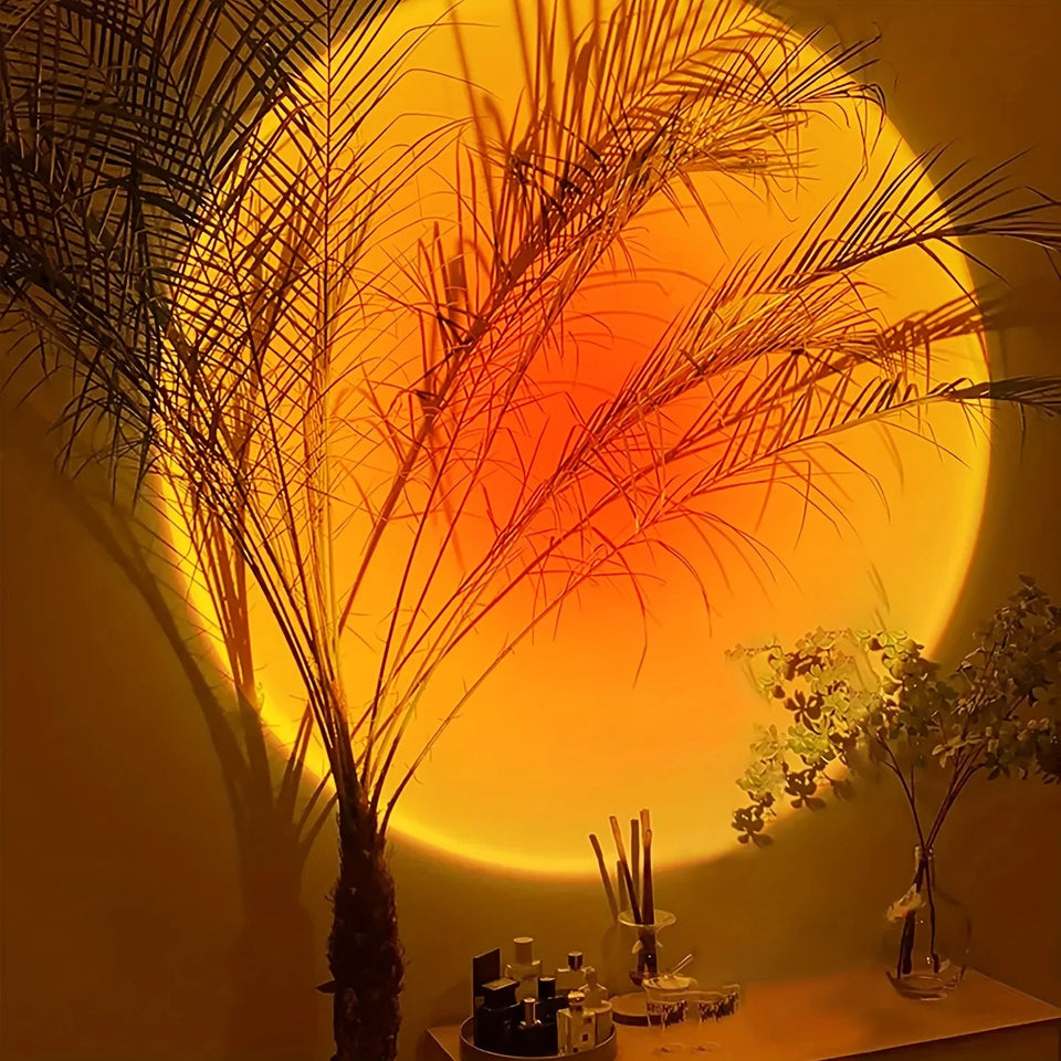 Sunset projection lamp illuminating room with colorful light