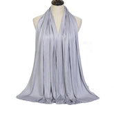 Long Muslim shawl made of modal cotton jersey fabric, wrapped elegantly around the head and ne
