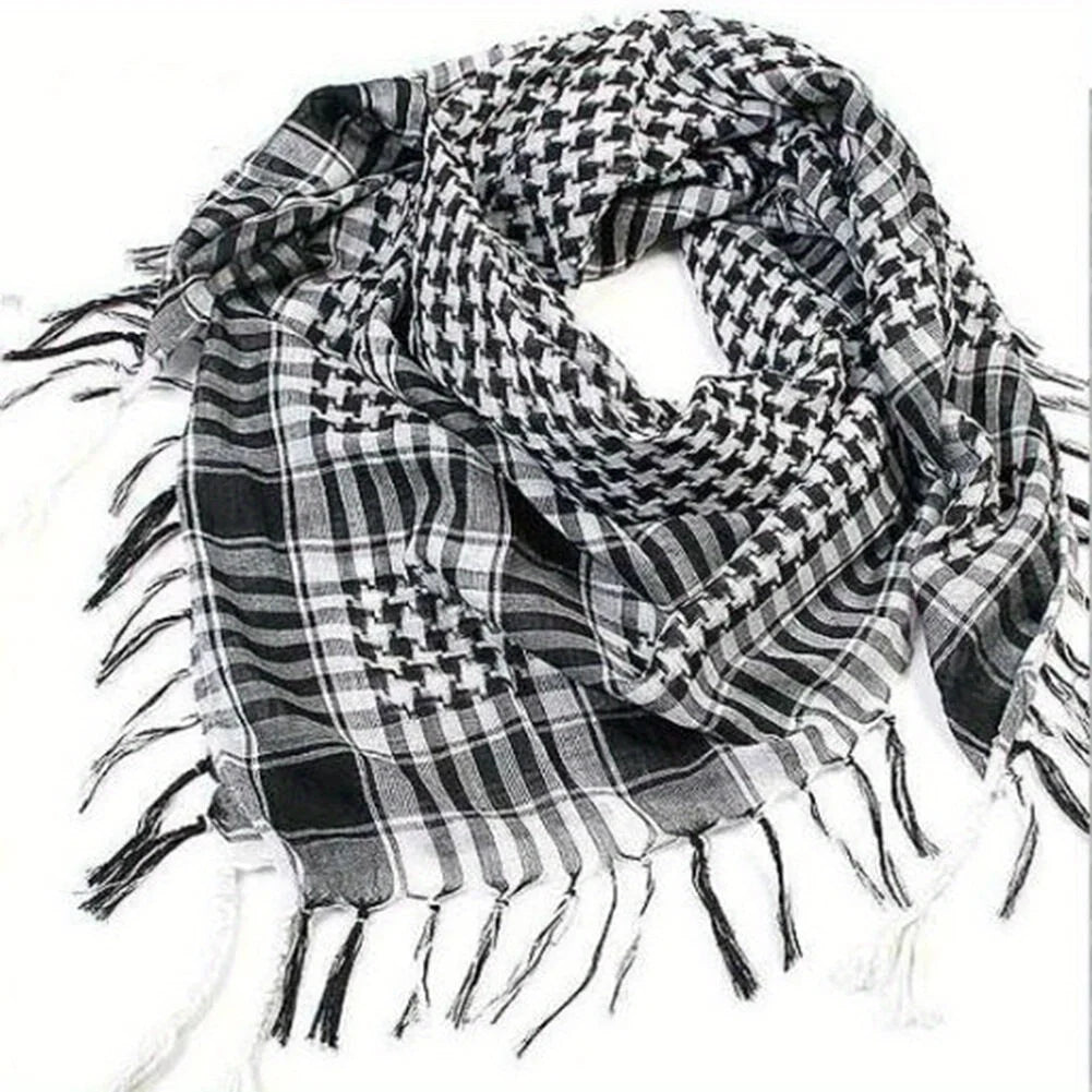 Arab shemagh scarf with traditional houndstooth pattern, styled as a face and neck wrap for sun protection