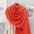 Elegant striped shawl wrap with tassel ends, suitable for casual and formal wear