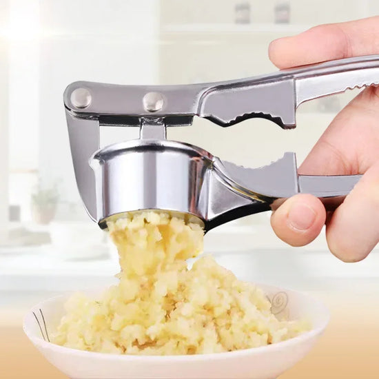 Stainless steel manual garlic press for crushing garlic into paste